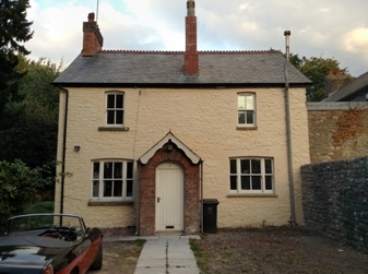 Repointed and limewashed cottage facade