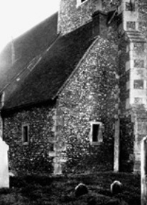 Hartlip, Kent: b/w photo showing exterior of masonry-built anchorhold with pitched roof