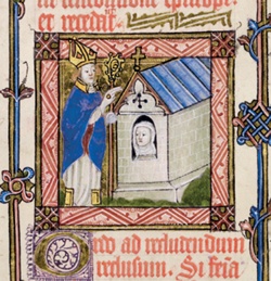 Illustration shows a bishop blessing a female anchorite who watches through the window of her anchorhold