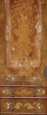 Damaged marquetry and veneer decoration on flush, panel-in-frame door