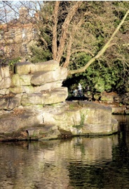Artificial rockwork at edge of ornamental lake