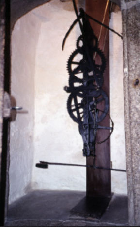 The wrought iron, turret clock in the chapel at Cotehele (National Trust) in Cornwall, c1485. The frame is of 'door frame' construction.