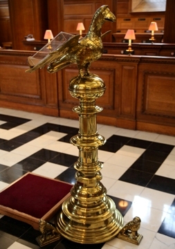 Brass eagle lectern with choir stalls in background