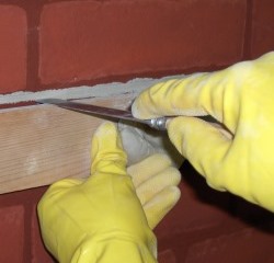 Close-up of Frenchman being used to trim a joint guided by a tomber straight-edge