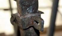 Close-up showing repaired lug and corroded surface