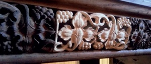 Replaced section of carving depicting grapes and vine leaves