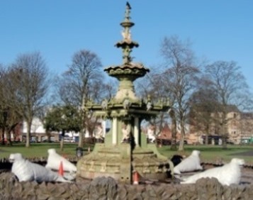 Cast iron fountain before repair with faded colour scheme