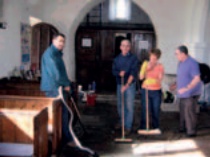 Local volunteers clean the interior of St Michael and All Angels