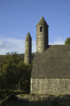 Round stone tower and church in Glendalough
