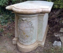 The conserved tomb with carved relief to the end section, which imitates the semi-cylindrical form of an engaged column
