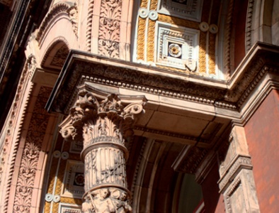 Ornate terracotta elements adorn an arch of the henry Cole building