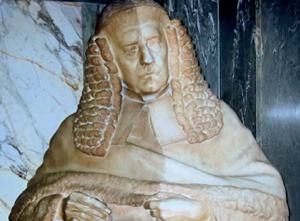 Marble statue of man in judge's wig and gown