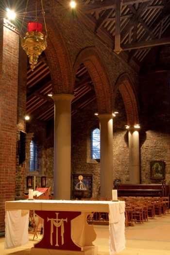 The nave at SS Julius and Aaron with modern altar in the foreground