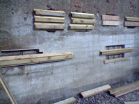 Formwork repairs to a concrete wall in progress