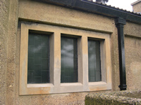 Repaired concrete window mullions