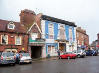 Disused and deteriorating cinema facade in Ringwood, Hampshire