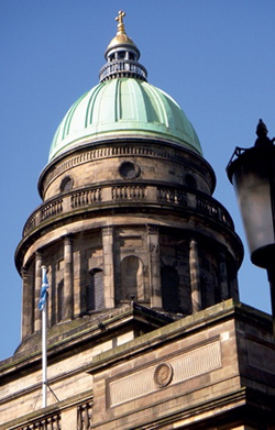 Copper-clad ribbed dome crowned by lantern with small gilded dome and cross