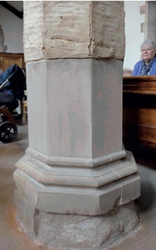 Evidence of damp travelling up a repaired stone column