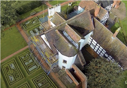 Aerial view of roofs and formal gardens