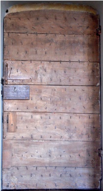 Back of a double plank door with planks running horizontally
