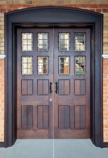 Pair of timber doors, each with four rectangular leaded lights 