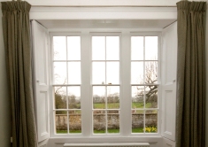 Georgian sash window with recessed shutters