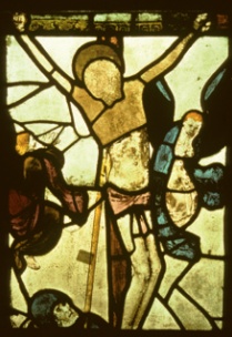 Crucufuxion scene at St Mary, Fairford in which the face of Christ has been replaced by a blank panel