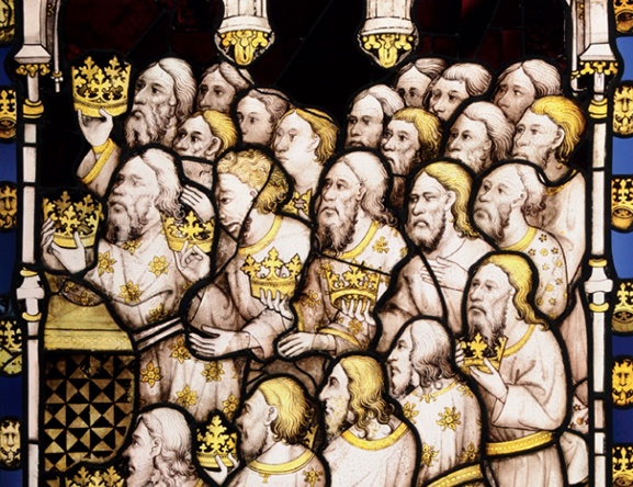Detail of The Great East Window of York Minster with intense blues and yellows and detailed, realistic faces