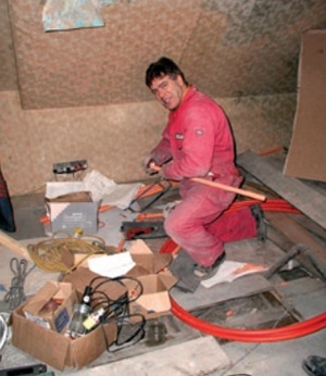Contractor installing pipework