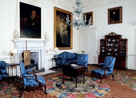 The plush interior of The Blue Drawing Room with its striking blue-upholstered furniture and richly patterned carpet
