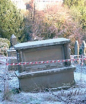 Chest tomb showing signs of collapsing into void below