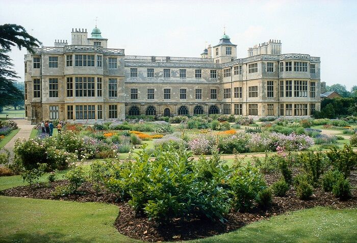 Audley End, Essex with colourful flower garden in the foreground