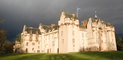 Fyvie Castle exterior with storm clouds in background
