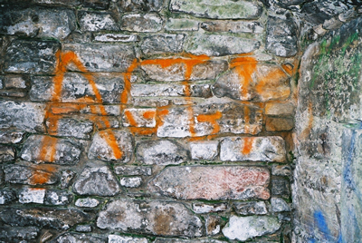 Graffiti on rubble masonry
