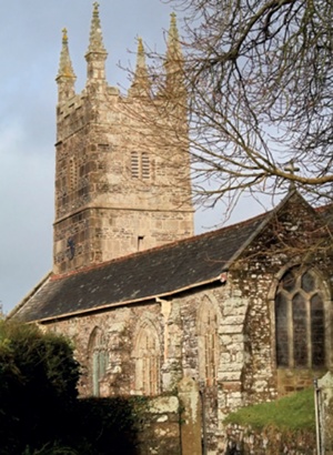 Church exterior with one face of church tower darkened by retained moisture