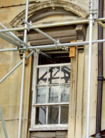 Sash window in historic stone facade