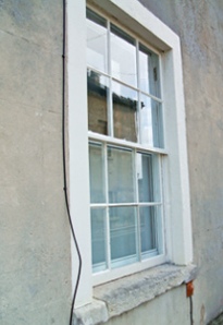 Secondary glazing behind sash window, exterior view