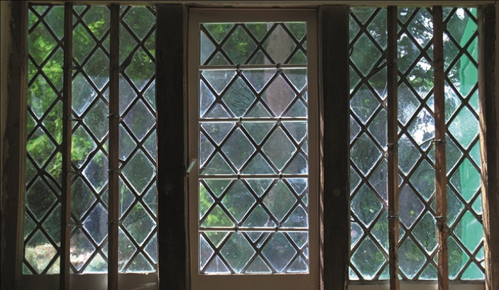 A leaded light window with small diamond-shaped panes in a Quaker meeting house