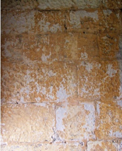 Remains of historic, ochre-coloured sheltercoat