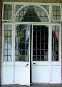 French doors with leaded panes and overlights including arch detail