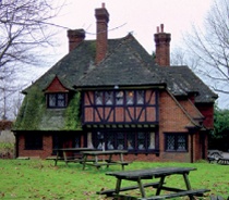 Tudor vernacular style inn with casement windows with leaded panes