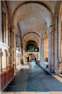 Ledger stones almost completely cover the floor of the choir aisle