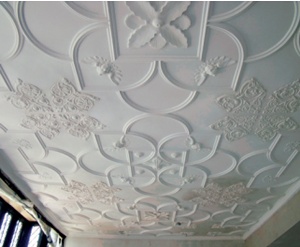 Elegant strapwork to a restored plaster ceiling