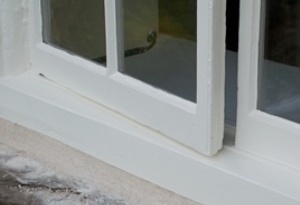 Exterior of timber casement window painted in a white, linseed oil paint finish