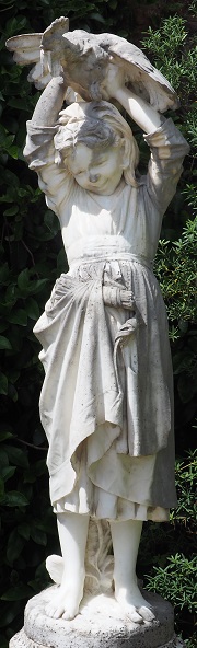 Marble organic statuary showing typical organic soiling with pitting on exposed surfaces
