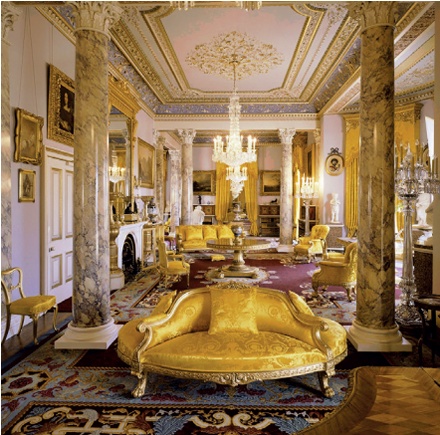 Opulent interior with marbled columns and yellow and gold soft furnishings