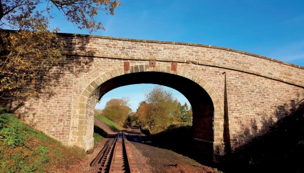 Repaired masonry railway bridge viewed from track level