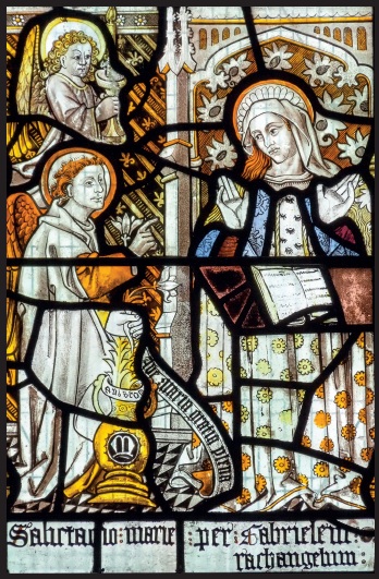 Stained glass depiction of the angel Gabriel and the Virgin Mary