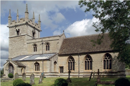 Rural historic stone church with large area of lead missing from pitched aisle roof