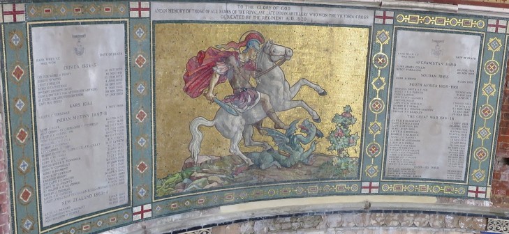 The restored mosaic flanked by two memorial panels and surrounded by colourful decorative borders